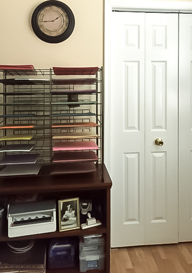 scrapbooking paper storage shelf next to closet