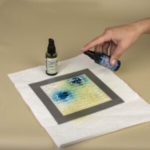 Coloring Ranger texture paste with Ranger Distress Spray