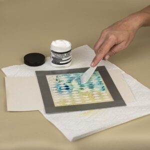 Coloring Ranger texture paste with Ranger Distress Spray