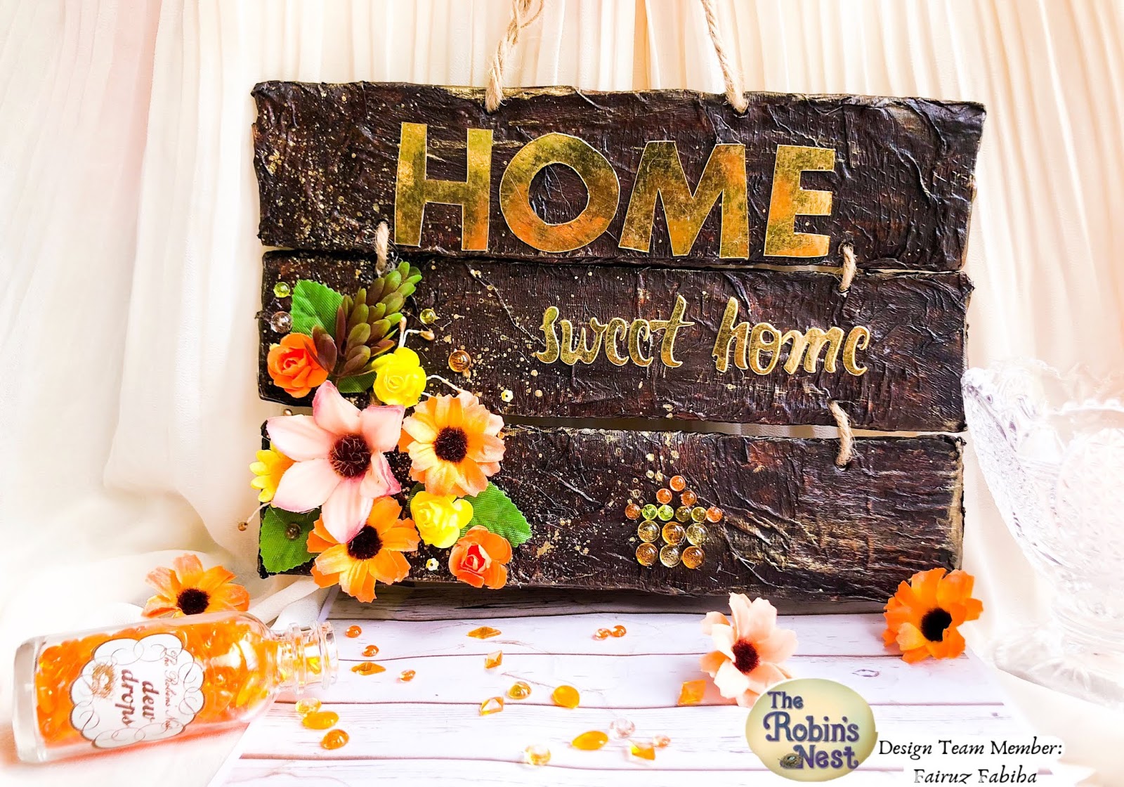 Details of a fall home decor wooden sign made of three pieces of wood decorated with The Robin's Nest Dewdrops